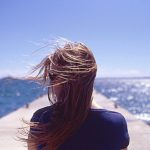 France, Juan les Pins, Rear view of woman with wind blowing