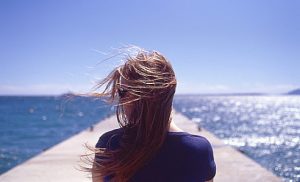 France, Juan les Pins, Rear view of woman with wind blowing